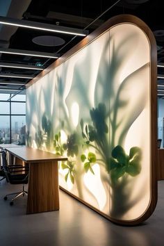 an office with a plant on the wall