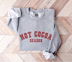 It's hot cocoa season! Our cute holiday sweatshirts are so comfy and cozy. They're soft, heavy and warm which makes them perfect for winter. These sweatshirts make a great gift for friends and family and anyone who loves hot chocolate, the holidays and the winter season. 50% polyester, 50% cotton Warm and cozy Fits true to size For an oversized look, we recommend ordering up a size or two depending on how big you like it! These shirts are made to order. Unfortunately, we are unable to speed up production times. It may be possible to expedite shipping only for an additional fee. Please message us for more information. Since all of our shirts are made to order, we do not accept returns. However, your satisfaction is incredibly important to us. If you experience any issues with your purchase, Fall Hot Chocolate, Ed Nurse, V Neck Shirts, Er Nurse, Emergency Department, Cool Mom, Round Neck Shirt, Retro Groovy, American Flag Shirt