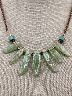 Handcrafted natural green Kyanite bib necklace with copper/turquoise accents on an 18 inch copper chain. Green Artisan Necklace With Patina, Artisan Green Necklace With Patina, Artisan Green Turquoise Necklace With Patina, Unique Green Patina Necklaces, Artisan Green Copper Necklace, Green Kyanite, Turquoise Accents, Copper Turquoise, Bib Necklaces