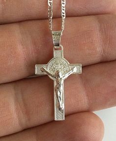 "925 STERLING SILVER SAINT BENEDICT CROSS NECKLACE . 20\" LONG GUCCI CHAIN. FOR GOOD LUCK ,PROSPERITY AND PROTECTION. PENDANT SIZE: 28 mm X 15 mm CADENA DE 925 PLATA ESTERLINA SAN BENITO CRUZ. CADENA 20\" LARGO GUCCI. PARA BUENA SUERTE ,PROSPERIDAD Y PROTECCIÓN... TAMAÑO DEL DIJE : 28 mm X 15 mm" Sterling Silver Crucifix Necklace With Silver Chain, Silver Crucifix Necklace With Charms, Stamped 925 Crucifix Necklace For Gift, Silver Sterling Silver Crucifix Necklace, Sterling Silver Necklace With Cross Pendant Stamped 925, Sterling Silver Crucifix Jewelry As Gift, Sterling Silver Cross Pendant Necklace With Charms, Silver Crucifix Chain Jewelry Gift, Silver Cross Jewelry With Charms