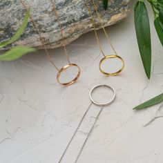 "♥ Inner Circle Necklace ♥ H O W ∙ T O ∙ O R D E R 1- Select your preferred Finish from the menu. 2- Choose your necklace length. 3- Write the custom words you want on your necklace. PRODUCT ∙ DETAILS * Ring Pendant Width is 13 mm * Outer Ring Diameter is 21mm * Ring Thickness is 100 microns * Chain sizes range from 14-22 inches * Featured Font name is Arial * Maximum Characters for Circle is 20 Letters *Necklace can be personalized with an engraving on the OUTSIDE and/or INSIDE of the circle. T Minimalist Engraved Jewelry For Wedding, Circular Jewelry With Adjustable Chain For Gift, Adjustable Full Circle Jewelry Gift, Halo Round Pendant Jewelry For Gift, Halo Round Pendant Jewelry Gift, Full Circle Halo Jewelry For Anniversary, Engraved Hoop Jewelry As Gift, Engraved Hoop Jewelry For Gift, Minimalist Full Circle Jewelry For Anniversary