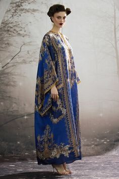 Blue silk long kaftan with all over regal floral prints and narrow yellow panel work. - Aza Fashions Blue Festive Kaftan With Dabka, Blue Dabka Kaftan For Festive Occasions, Festive Blue Dabka Kaftan, Elegant Silk Kaftan For Festivals, Blue Bohemian Kaftan With Traditional Drape, Blue Traditional Drape Kaftan For Eid, Blue Kaftan For Eid With Traditional Drape, Festive Blue Kaftan With Kimono Sleeves, Blue Traditional Drape Kaftan For Festivals