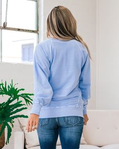 Girlfriend Crewneck Sweatshirt - Spring Blue Spring blue Crewneck Side pockets Ribbed details Good stretch Body: 100% Cotton Ribbing: 95% Cotton 5% Spandex Imported General Sizing: Small (0-4), Medium (6-8), Large (10-12), XLarge (14-16)True to sizeAdrienne is a size 4 and is wearing a Small Measurements: Small: Bust: 22" // Length: 26" Medium: Bust: 22.5" // Length: 26.5" Large: Bust: 23" // Length: 27" XLarge: Bust: 23.5" // Length: 27.5" Bust measurements are taken across the chest laying fla Casual Stretch Tops With Ribbed Cuffs, Soft-washed Relaxed Fit Sweatshirt, Blue Relaxed Fit Sweatshirt, Blue Long Sleeve Soft-washed Sweatshirt, Plain Stretch Crew Neck Sweater, Light Blue Long Sleeve Top With Pockets, Blue Crew Neck Sweatshirt For Everyday, Crew Neck Tops With Pockets For Loungewear, Washed Blue Crew Neck Sweatshirt Soft-washed