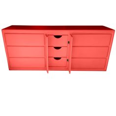 an orange dresser with three drawers and two doors