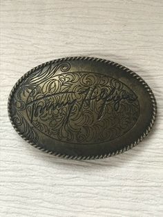 Estate Etched Oval Antique Goldtone TOMMY HILFIGER Metal Oval Belt Buckle – 3.25 x 2.25 - VERY GOOD condition – minor signs of wear – needs a little cleaning - (Location – Small Purple Rubbermaid)  *********************************************************************************************************************************************************************************************************************** NOTE: I am selling these to make more room in our very small, cramped house. Unless I Oval Belt, Belt Buckle, Belt Buckles, Etching, Tommy Hilfiger, Gold Tones, Buckle, Signs, Purple