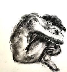 a black and white drawing of a man sitting on the ground with his head in his hands