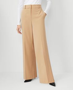 Elevate your wardrobe with the sophisticated charm of Ann Taylor's Wide Leg Pants. These pants are a testament to modern elegance with their flowing wide leg design and flattering high waist. Perfect for both office and evening wear, these pants ensure you look effortlessly chic in any setting.

- Size: 0
- Color: Baguette
- Material: 62% Polyester, 34% Viscose, 4% Spandex
- Fit: Relaxed and easy
- Rise: High rise, sits 1/2" to 1" below natural waist
- Length: Full length, 31" inseam with a 25" Tan Pants Outfit, Colored Dress Pants, Dress Pants Women, Camel Pants, Outstanding Outfits, Knitted Suit, Tan Pants, Pants Outfits, Womens Dress Pants