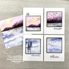 four watercolor cards with trees and clouds on them, one is blue and the other is purple