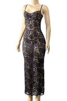 a mannequin wearing a black lace dress