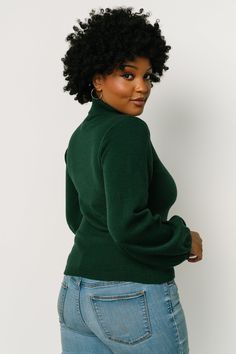 Dark emerald green color Soft knit material has stretch Turtleneck Sleeves widen near bottom Ribbed at neck, sleeve cuffs, and hem 57% Viscose, 27% Polyester, 17% Polyamide Sierra is 5’8, cup size 37”, size 6/8 and wearing size M Dark Emerald Green, Emerald Green Color, Weather Seasons, Classic Sweater, Cup Size, Knitting Materials, Soft Knits, Turtleneck Sweater, Emerald Green