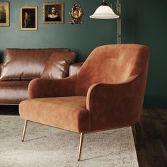 a living room with two couches, a chair and pictures on the wall behind it