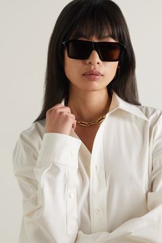 Bottega Veneta's eyewear is as collectible as its distinctive bags. These tortoiseshell sunglasses are made from recycled-acetate in a chunky, angular shape. Take styling cues from <i>PORTER</i>, who says square frames "will look just as good with a casual tank top as they will with crisp tailoring." Tortoiseshell Sunglasses, Tailoring Details, Tortoise Shell Sunglasses, Eyewear Womens, Casual Tank Tops, Square Frames, Tortoise Shell, Net A Porter, Bottega Veneta