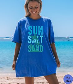 🏝️Retro Sun Salt Sand summer beach vacation Comfort Colors shirt!🏝️ This trendy t-shirt is super soft and comfortable made of 100% ring-spun ethically grown cotton. It has a relaxed fit that is made of a medium fabric that is preshrunk. Looks super cute with shirts, jeans or as an oversized beach cover up. Great gift idea for a Birthday or Beach lover! Comes in 14 pretty colors!  💠💠Pepper, Topaz Blue and Royal Caribbean will have the Kelly Green Palm tree and Turquoise and Green letter graph Casual Beach T-shirt For Warm Weather, Beach Cotton T-shirt For Warm Weather, Casual Pre-shrunk T-shirt For Beach, Cotton T-shirt For Beach In Warm Weather, Blue Beach Tops With Upf 50+, Blue Tops For Beach With Upf 50+, Upf 50+ Short Sleeve Beachwear Tops, Upf 50+ Short Sleeve Beach Tops, Beach Tops With Sun Protection And Short Sleeves