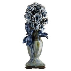 a blue and white vase with flowers in it