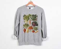 Welcome to Pink Pepper Designs Co.! All our adult and youth sweatshirts and hoodies are a super comfy style from Gildan, and are pre-shrunk blend of 50% polyester and 50% cotton. Cottagecore Vintage Vegetables Sweatshirt, Vintage Botanical Veggies Illustration, Gardening Aesthetic Sweatshirt, Light Academia Botanical Crewneck to 5XL We do not support companies that make use of child labor or sweatshops! Our amazing printing partner uses a Direct to Garment printing process using water-based biod Fall Casual Sweatshirt With Plant Print, Casual Plants Print Sweatshirt For Fall, Botanical Style Cotton Sweatshirt For Fall, Fall Cotton Sweatshirt With Plant Print, Cotton Sweatshirt With Plants Print For Fall, Veggies Illustration, Vintage Vegetables, Illustration Botanique Vintage, Gardening Aesthetic