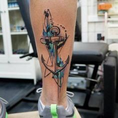 an anchor tattoo on the leg of a person