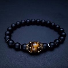 Not only does the Luxury Antique Crown with Black Onyx and Tiger's Eye Bracelet look great and make the perfect gift for someone. Black Onyx brings immensely powerful vibrations of Protection Willpower, Focus and Strength. Many believe the onyx helps drive motivation and continuously push you forward in your life. It is an excellent choice for healers to use with it comes to emotional, mental and physical healing. The Tiger Eye represents the power, courage and fearlessness of the tiger. Tigers Gemstone Crown, Stone Bead Bracelets, Antique Crown, Lion Head Bracelet, Crown Bracelet, Brown Tiger Eye, Tiger Eye Bracelet, Natural Stones Necklace, Natural Stone Jewelry