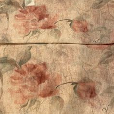 an old piece of cloth with flowers on it