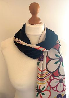 Add a bit of luxury to your wardrobe with this handmade vintage kimono fabric  and silk velvet scarf! The scarf is black silk velvet one one side and a traditional Japanese silk kimono fabric on the other . The silk kimono is unique and is taken from the sleeve of a kimono that dates back to the 1960's. It is a soft and crepe silk which features a traditional flower pattern.  This is a one-off design so is unique! The scarf is lightweight and has a very beautiful drape which allows it to be tied Black Silk Scarves As A Gift, Traditional Black Silk Scarves, Black Artistic Silk Scarf, Traditional Black Silk Scarf, Black Bohemian Silk Scarf, Black Silk Bohemian Shawl, Vintage Black Silk Scarf Gift, Artistic Black Silk Scarves, Artistic Black Silk Scarf