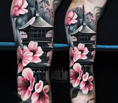 the legs are covered in tattoos with pink flowers and pagodas on top of them