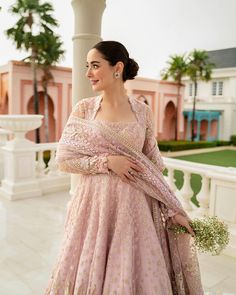 Pakistani Wedding Dress in Pink Pishwas Frock Style is a stunning attire adorned with hand-crafted details of embellishments. Premium quality fabric and lavish work of tilla and sequins make this Pishwas Dress your foremost priority to wear on the big day. Pishwas Frock: This Pishwas Frock in alluring pink color is emblazoned with lavish embroidery, motifs, sequins, and tilla. The stunning work of Resham, floral designs, goldwork, and shimmering ornaments give a glamorous touch to the Pishwas Dress. The fabric of this Pishwas is premium net. Silk Trousers: The heavily embellished Pishwas Frock in net fabric is paired with trousers, creating a perfect Pakistani Wedding Dress. The trousers comes in silk fabric and are perfectly stitched as per customer's choice, creating a flawless masterpie Faiza Saqlain, Dupatta Style, Frock Style, Semi Formal Wear, Pakistani Wedding Outfits, Pakistani Wedding Dress, Pink Wedding Dresses, Chiffon Collection, Embroidered Bodice