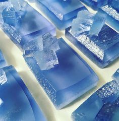 several pieces of blue glass sitting on top of a table