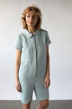 Linen playsuit made from a soft, medium weight, washed linen. Peter pan collar, hidden button closure, short sleeves.  - Handmade in our studio from from 100% linen - Relaxed fit with buttons opening at the front side - Peter pan color - Short sleeves - Front square pockets  - Seam side pockets Fitted Linen Jumpsuits And Rompers With Pockets, Summer Linen Jumpsuits And Rompers With Button Closure, Relaxed Fit Linen Jumpsuit With Short Sleeves, Relaxed Fit Linen Jumpsuits And Rompers With Short Sleeves, Relaxed Fit Linen Short-sleeved Jumpsuit, Casual Linen Jumpsuits And Rompers With Buttons, Pocket Doll, Collar Jumpsuit, Solid Color Jumpsuits