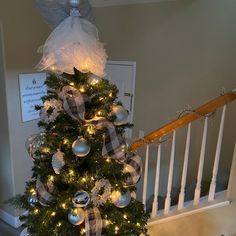 a decorated christmas tree with lights and ornaments