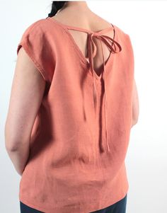 "Handmade natural washed linen loose top. Made with love for You. *100% local medium weight linen *Each item is individually cut and sewn by order *The model is wearing size S, blouse color - Apricot *Note that colors may look different on your display depending on their settings and technical characteristics. Please let us know if you need different measurements or colors. CARE *Machine wash up to 40 / 104F gentle cycle *Iron inside out at medium high *Do not bleach *Do not tumble dry MAKING TI Casual Linen Tie-back Tops, Bohemian Linen Short Sleeve Blouse, Bohemian Short-sleeve Linen Blouse, Bohemian Short Sleeve Linen Blouse, Casual Short Sleeve Tops With Tie Back, Linen Tops With Natural Dye And Short Sleeves, Short Sleeve Linen Tops With Natural Dye, Beach-ready Short Sleeve Tops With Tie Back, Beach Short Sleeve Tops With Tie Back