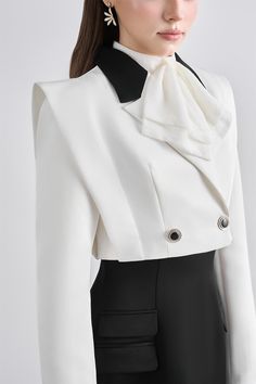 Expertly crafted with a structured double-breasted design, this jacket exudes sophistication and style. Perfect for any occasion, this jacket offers a flattering silhouette and timeless elegance. Made with precision and attention to detail, it is a must-have addition to any wardrobe. Short Jacket For Women, Elegant Structured Blazer With Lapel Collar, Chic Structured Party Blazer, Chic Structured Formal Outerwear, Chic Tailored Formal Outerwear, Formal Double-breasted Cropped Jacket For Fall, Formal Double-breasted Cropped Jacket For Winter, Formal Double-breasted Cropped Winter Jacket, Designer Structured Evening Outerwear