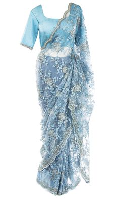 Saree is pre-stitched Saree is pre-pleated Matching underskirt is included 2 Blouse options:Option 1: Sleeved blouse with an adjustable drawstring back and padded insertsOption 2: Spaghetti strap blouse See Size Guide for sizing detail.A gorgeous lacy net Saree embellished with beaded blue and silver florals and shimmering rhinestones all over, especially the bejeweled scallop border. In this outfit, the skies are never gray. Blue Sari, Spaghetti Strap Blouse, Mens Indian Wear, Strap Blouse, Stitched Saree, Western Wear Dresses, Scallop Border, Spaghetti Strap Blouses, Net Saree