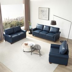 a living room with blue leather furniture and a white rug on the floor in front of a large window