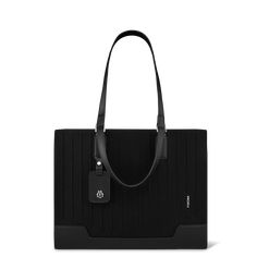 Made in Italy, the RIMOWA Never Still collection is designed with flexibility in mind. The Never Still - Canvas Tote Large in black is a sophisticated daily companion for accomodating your everyday essentials. Crafted from premium materials like durable canvas and full-grain leather, you can choose between wearing the tote on your shoulder or as a handbag. It features several functionalities: - One main roomy compartment - An internal zipped pocket - An innovative double handle system (short 16. Black Rimowa, Unique Gift Guide, Daily Essentials, Large Bag, Personal Marketing, Travel Backpack, Papaya, Full Grain Leather, Travel Accessories