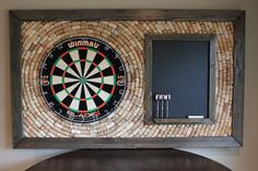 a dart board mounted to the side of a wall