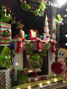 a christmas display in a store window with decorations