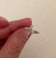 VINTAGE 10 KARAT DIAMOND CROSS RING ♥ ♡ ♥ ♡ ♥ ♡ ♥ ITEM DESCRIPTION:  * Band width: 1mm * Size  6.5 ‣ Cross Width: 12.8mm ‣ Diamond Weight: 0.03 carats * Condition: Great! Like new condition  ‣ All vintage items are professionally cleaned ♥ ♡ ♥ ♡ ♥ ♡ ♥ SHIPPING INFORMATION: ‣ Item comes with free tracked shipping within Canada ‣ If you do wish to have a faster shipping option please let us know!  ♥ ♡ ♥ ♡ ♥ ♡ ♥ Diamond Cross Rings For Gifts, Diamond Cross Ring For Gift, Cross-shaped Diamond Ring For Gift, Cross Ring With Diamond Accents For Promise, Diamond Accented Cross Promise Ring, Cross-shaped Promise Ring With Diamond Accents, Cross Shaped Promise Ring With Diamond Accents, Gold Diamond Cross Ring, Diamond Cross Ring For Anniversary