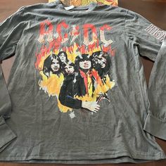 a long sleeved shirt with an image of the band hard rock on it's chest