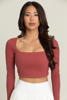 Pale Red Square Neck Long Sleeve Top﻿ is the year round staple you've been missing. It features a flattering square neckline to make any look more sophisticated and built-in removable padding for your preferred amount of support. Square Neckline Built-In Removable Padding Model Details: Modeled in size: Small Model Waist: 23 Model Bust: 34 Model Height: 5'8 Red Square Neck Top For Spring, Fitted Square Neck Solid Color Top, Red Square Neck Top For Summer, Red Fitted Top With Square Neck, Bra-friendly Solid Color Square Neck Top, Tennis Skirts, Athletic Top, Yoga Tops, Square Necklines