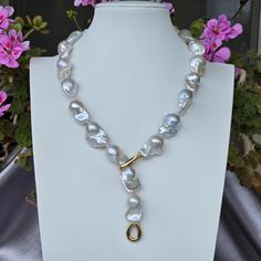 This strand is absolutely gorgeous! It represents the finest of the finest of Freshwater Baroque pearls. it has a 14Kt. Italian Gold Clasp weighing 7.7 grams, I have only the same clasp with 0.2 cart sparkling diamonds. The necklace can be locked in two different ways:  1. With the little tail; and 2. As a whole necklace 3.  Adjustable length, you may lock the necklace on any pearl you wish These pearls anr rare, they  measure 16-24mm and have a pinkish overtone.  The length of the necklace is 5 Luxury Formal Baroque Pearl Necklace, Luxury Baroque Pearl Necklaces In Pear Shape, Luxury Single Strand Baroque Pearl Necklace, Baroque Pearl Necklace, Pearl Necklaces, Wedding Jewellery Necklace, Wedding Necklaces, Sparkle Diamonds, Beautiful Gift Boxes