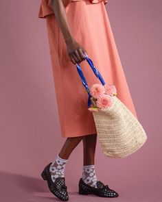 up close of model holding beige bag with blue bandana handle Spring Straw Bag For Daily Use With Adjustable Strap, Woven Crochet Bag For Spring Day Out, Spring Crochet Bag With Handles In Natural Color, Spring Jute Crochet Bag With Handles, Spring Woven Crochet Bag For Day Out, Spring Crochet Bag With Braided Handles, Summer Crochet Woven Bag For Day Out, Trendy Spring Picnic Bags, Rectangular Crochet Bag For Spring Day Out