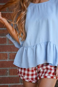 So cute and so comfy! These gingham shorts boast the season's hottest trend and have a comfortable, functional drawstring waistband. Shorts are lined. Wear them with our "Ruffled Chambray Top" for an extra cute look. Blue Denim Top For Everyday Spring Wear, Breezy Cotton Top For Day Out, Chic Short Sleeve Denim Top For Day Out, Everyday Blue Denim Top For Spring, Spring Everyday Blue Denim Top, Casual Light Wash Top With Ruffles, Chic Summer Denim Top With Short Sleeves, Chic Short Sleeve Denim Top For Summer, Light Blue Relaxed Fit Denim Top For Summer