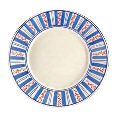 a blue and white plate with red designs on the rim, against a white background