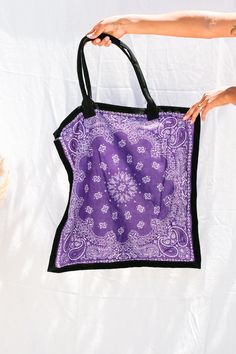 FINAL SALE 100% Cotton bandana with leather trim and handles. Made in India. Trendy Purple Bag With Dust Bag Included, Purple Square Bags For Summer, Purple Square Bag For Summer, Summer Purple Square Bag, Purple Rectangular Bag With Dust Bag, Purple Rectangular Bag, Purple Rectangular Bag For Summer, Reversible Square Bags, Trendy Handmade Purple Bag