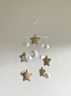 a crocheted star mobile hanging from the ceiling