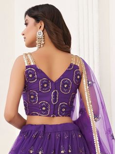 Let your elegance reflect and receive compliments with the stunning Pretty Purple Butterfly Net Lehenga Choli from Ethnic Plus. This exquisite lehenga choli in a beautiful purple color is made from high-quality butterfly net material.
Designed with a V shape neck, this party wear lehenga is sure to make you the center of attention at any occasion. The A-line silhouette flatters every body type, giving you an elegant and graceful appearance.
The lehenga comes semi-stitched and can be customized u Diwali Semi-stitched Net Choli, Purple Art Silk Blouse Piece For Reception, Fitted Net Blouse Piece For Festivals, Unstitched Choli For Diwali Party Wear, Purple Sets With Sheer Dupatta For Reception, Eid Fitted Net Choli, Eid Festival Fitted Net Choli, Eid Net Choli Fitted, Eid Net Fitted Choli