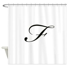 a shower curtain with the letter f in black on white fabric, hanging from a metal rod