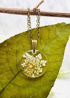 This beautiful floral mustard seed necklace is perfect for any occasion!  Share your faith and your love of nature everywhere you go. This beautiful handmade resin necklace makes the perfect gift for a loved one, a best friend, or just a reminder of your own inner beauty and faith.  Necklace is handmade with resin, real flowers, mustard seeds, and an antique bronze chain.  Chain Length: 18 inches long  Chain Width: 1.5 mm Antique Bronze chain with lobster clasp Please contact me if you have any questions or requests. Due to the handmade nature of the resin process no two necklaces will ever be exactly identical. Please keep in mind that there may be some minor imperfections in the resin, such as tiny air bubbles SHOP DESCRIPTION: Resin jewelry has endless possibilities and I love creating Mustard Seed Faith Craft, Sister In Christ, Growing Faith, Mustard Seed Jewelry, Mustard Seed Faith, Faith Crafts, Mustard Seed Necklace, Seed Necklace, Faith Necklace