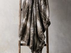 a chair with a blanket draped over it