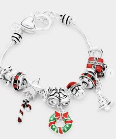 This beautiful Christmas-themed charm bracelet has an elegant look to it and is a fun detail to any outfit. Party Charm Bracelet With Dangle, Elegant Christmas Holiday Jewelry, Christmas Holiday Bracelet Jewelry, Christmas Party Adjustable Charm Bracelet, Christmas Festive Silver Charm Bracelet, Adjustable Christmas Jewelry For Holiday, Christmas Festive Jewelry With Charms, Christmas Holiday Jewelry Bracelet, Christmas Dangle Jewelry For Celebration