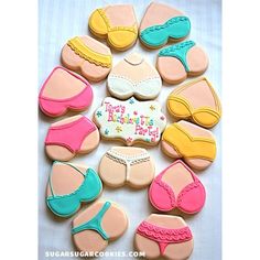 decorated cookies are arranged in the shape of bikinis